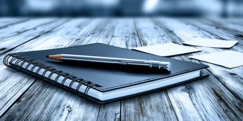 Notebook organizer on wooden desk with pencil narrow version